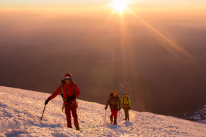 Nearing the 14,410ft summit of Mt. Rainier at sunrise is unforgettable.