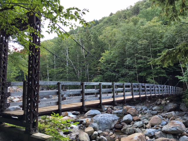 A picturesque suspension bridge, rebuilt in 2009, makes this crossing the easiest of the route.