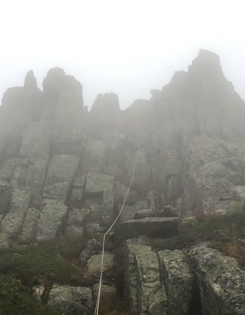 Topping out on the Knife's Edge and headed into the mist.